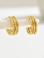 18K gold-plated textured triple band hoop earrings with a stylish, layered design and shiny finish.