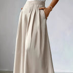 Women's high-waist pleated wide-leg linen pants by FitiqueFit, relaxed bohemian casualwear with a loose fit and flowing design.