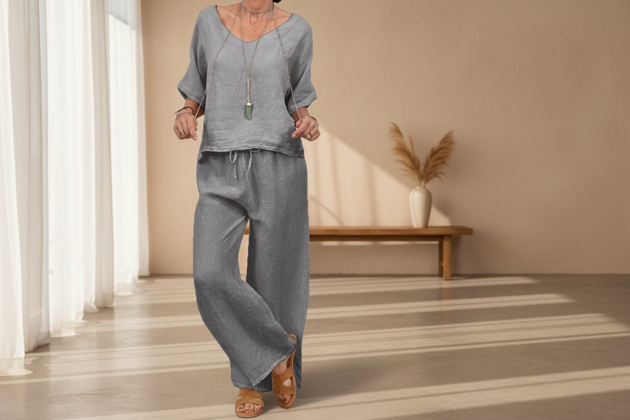 Women’s multi-color two-piece casualwear set with V-neck top and matching pants by Plush Fashion Hub, displayed on a model.