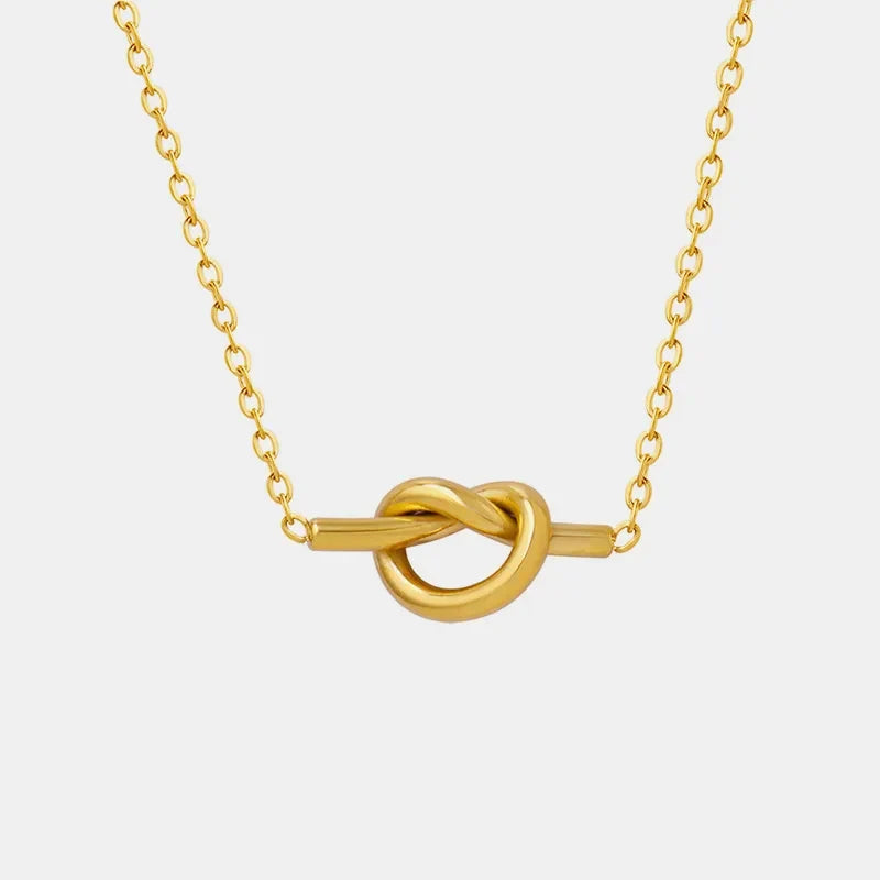 18K gold-plated titanium steel knot necklace with sleek design and shiny finish, displayed on a neutral background.