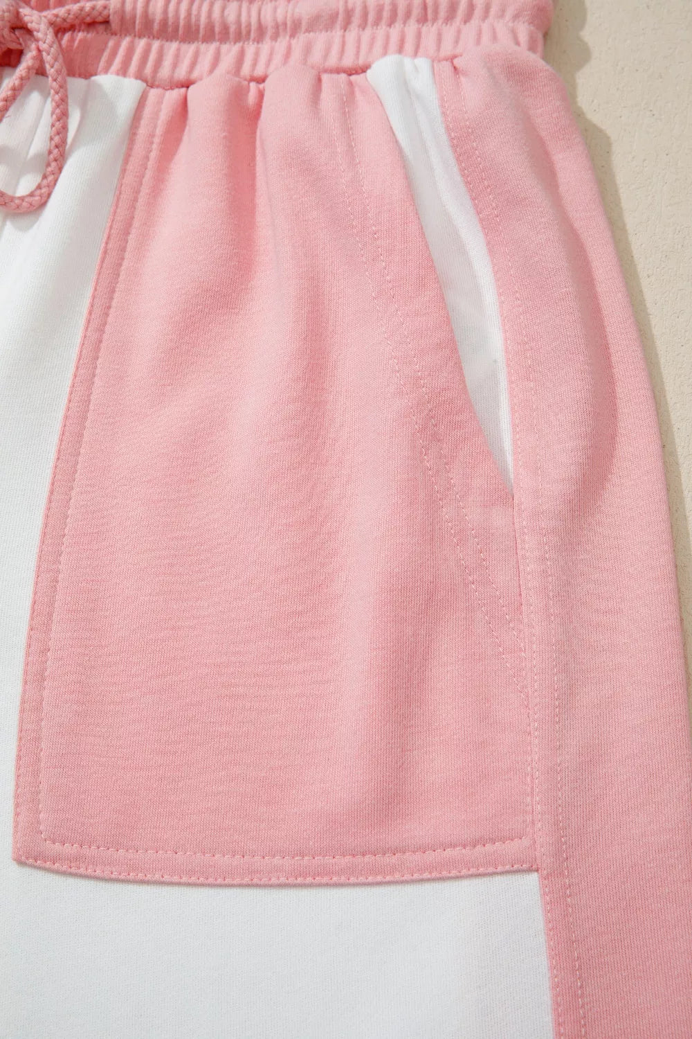 Two-tone color block patchwork tee and drawstring loose pant set by Trendsi, casual stylish outfit with matching top and bottoms.