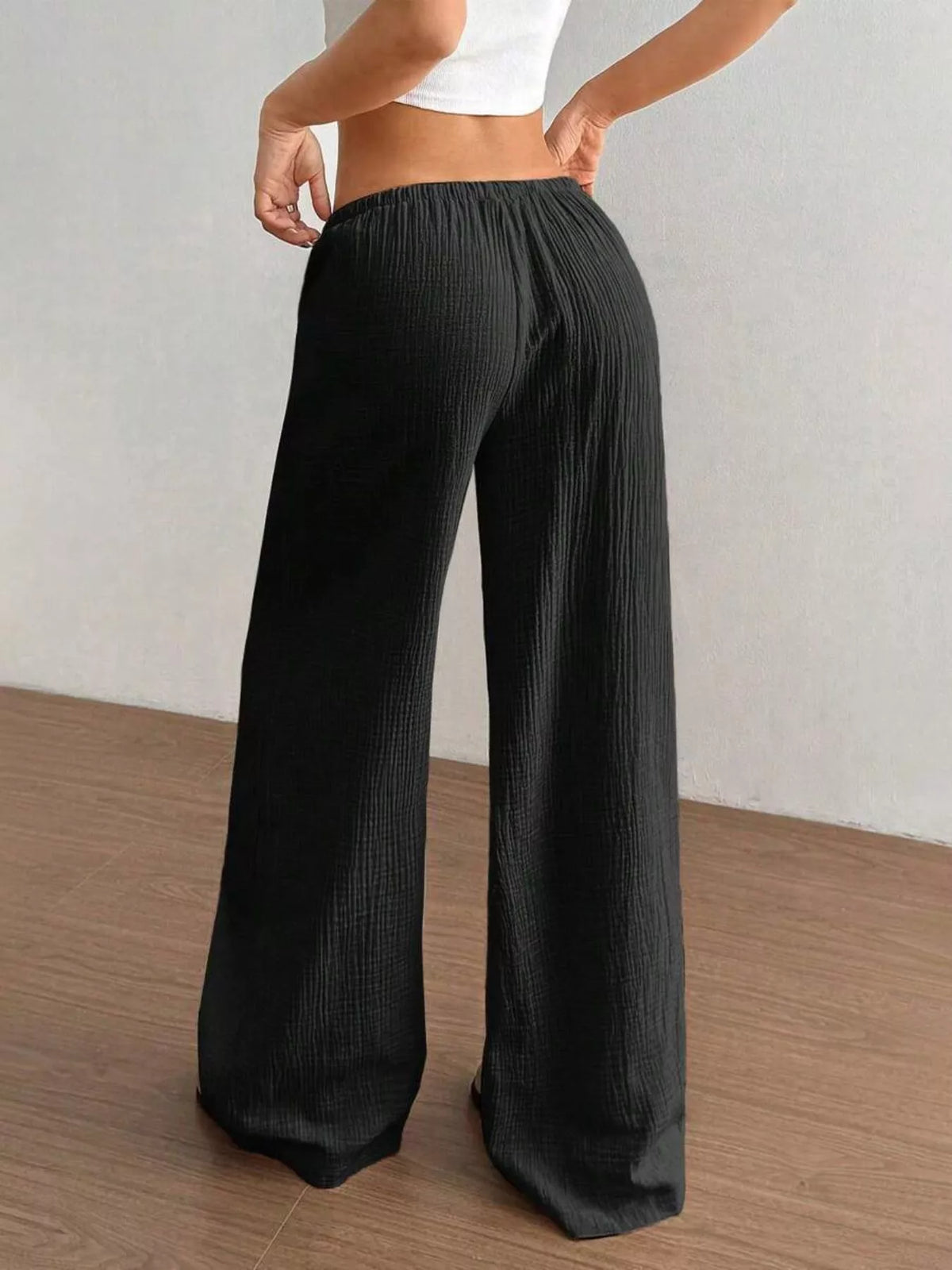 Plush Fashion Hub wide-leg drawstring pants featuring soft plush fabric and a relaxed fit, shown in a natural pose.