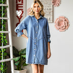 Women's three-quarter sleeve denim dress with ruffle detail and mid-length fit by FitiqueFit, shown on a model.