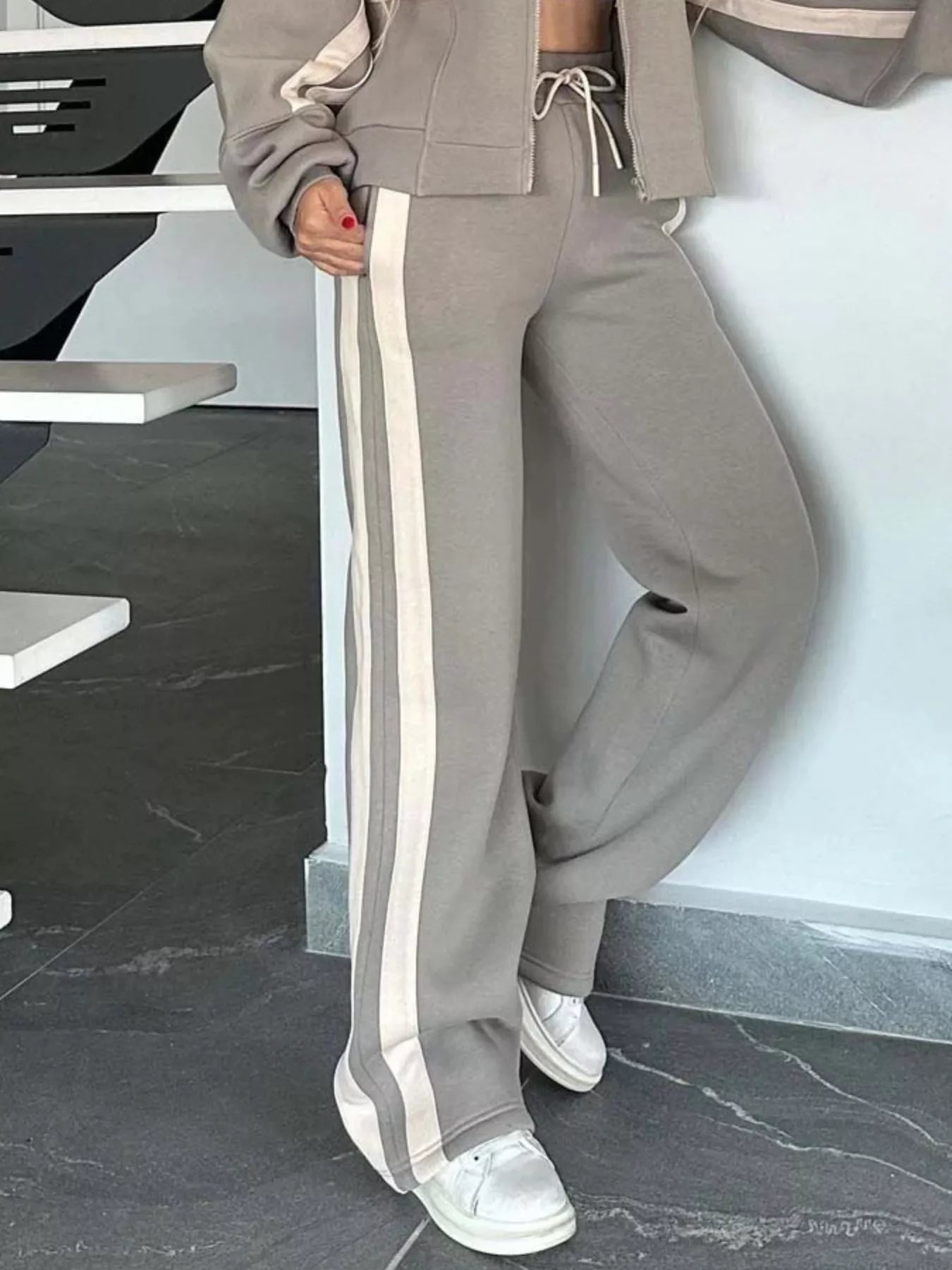 Plus size contrast stripe zip-up activewear jacket and pants set by Plush Fashion Hub, featuring bold stripe details and comfortable fit.