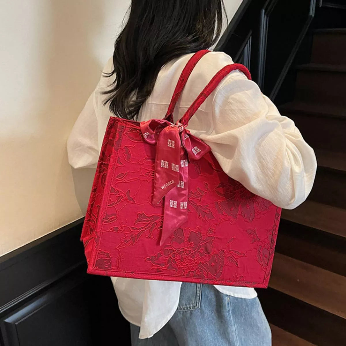 Floral embossed tote handbag with scarf accent by Shopimist, featuring textured floral design and stylish fabric scarf detail.
