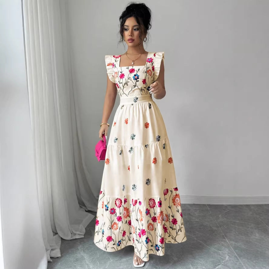 Women's floral print waist-cinching dress with puff sleeves by FitiqueFit, showcasing a stylish and flowy design.