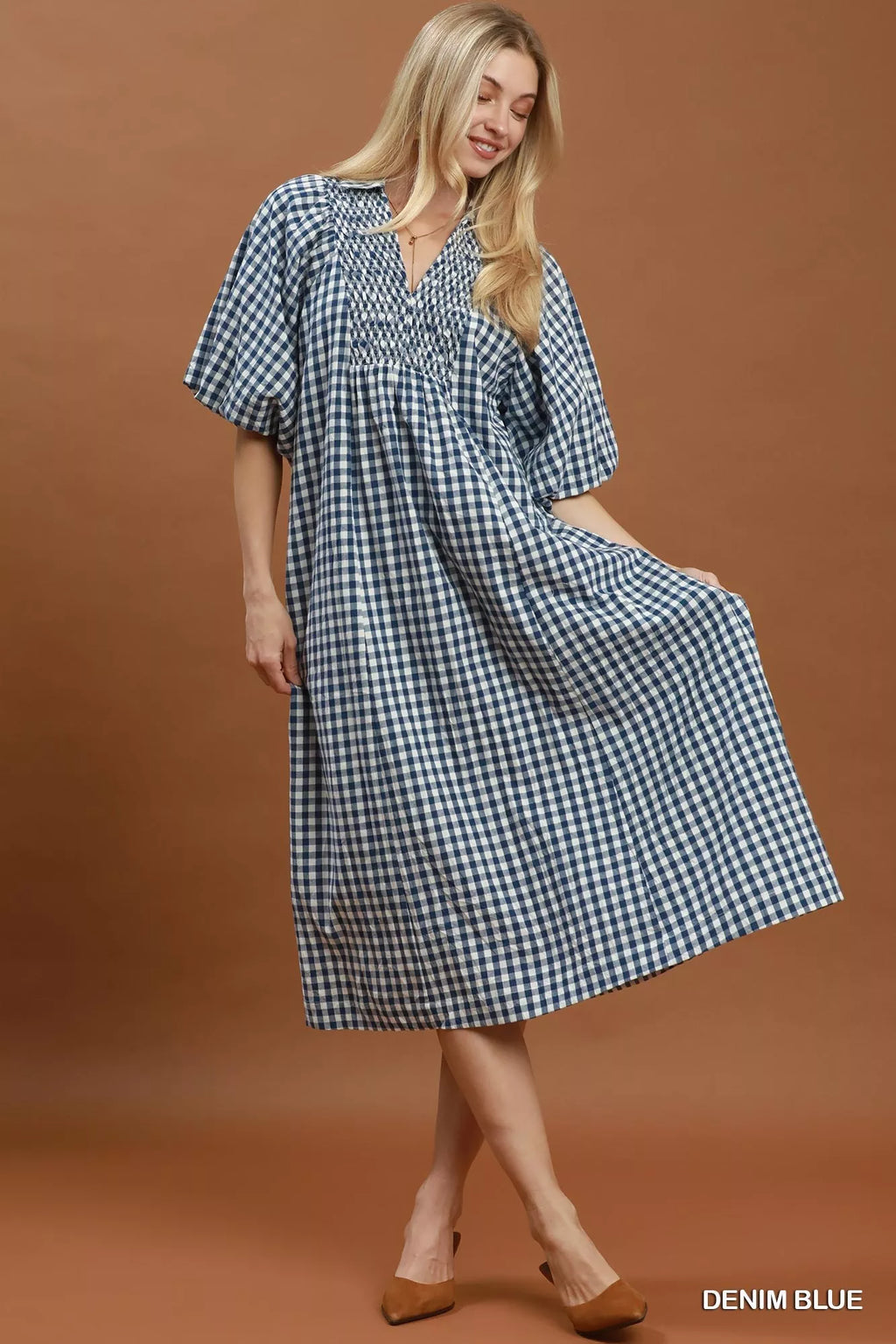 Umgee puff sleeve plaid midi dress with a fitted waist and stylish design, perfect for casual or semi-formal occasions.