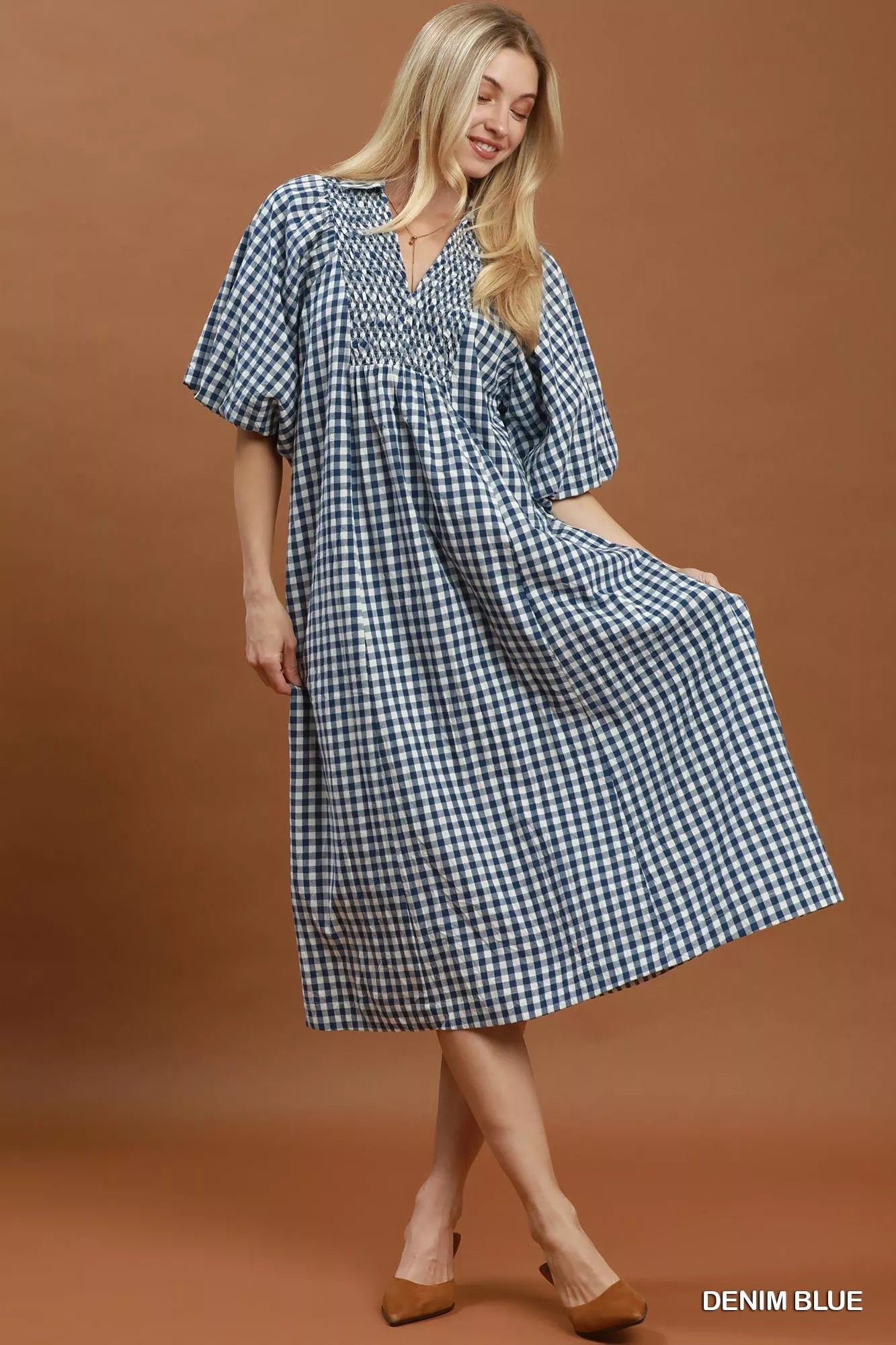 Umgee puff sleeve plaid midi dress with a fitted waist and stylish design, perfect for casual or semi-formal occasions.