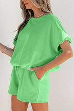 Pair of solid color puffy loose fit drawstring shorts from Trendsi, shown as part of a 2-piece outfit.