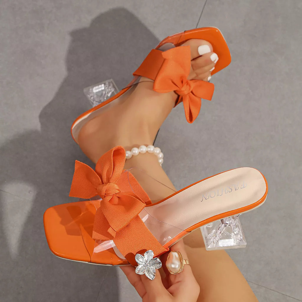 Open toe bow sandals by Shopimist featuring stylish straps and a comfortable flat sole, perfect for warm weather wear.