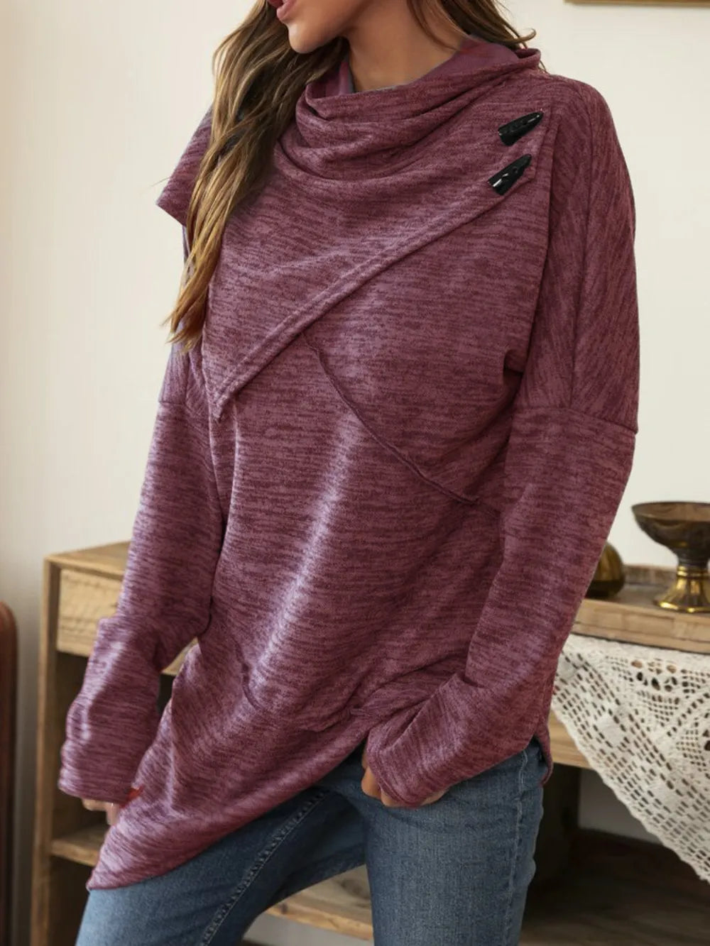 Asymmetrical hem cowl neck long sleeve T-shirt by Trendsi, featuring a stylish draped neckline and unique hem detail in soft fabric.