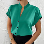 Light orange satin V-neck short sleeve shirt for women, casualwear by Plush Fashion Hub, shown flat on a white background.
