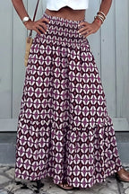 Geometric print smocked waist maxi skirt from Plush Fashion Hub, flowing dress with a vibrant pattern and comfortable fit.