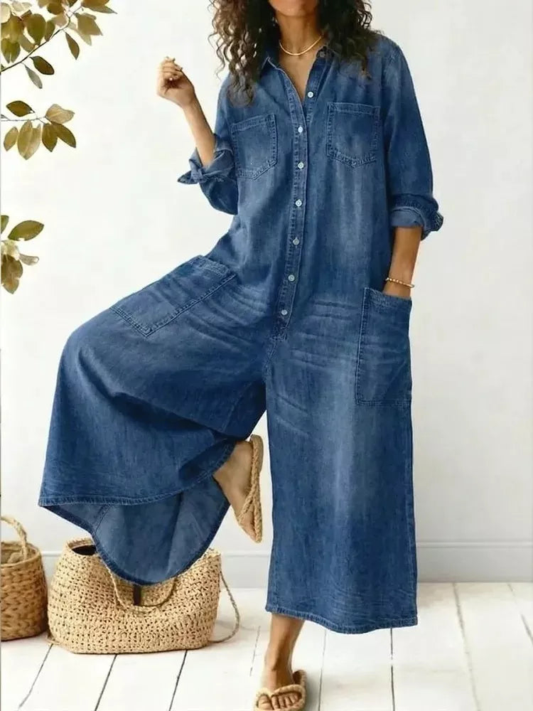 Plus size full button-front wide-leg jumpsuit with chest pockets, stylish and comfortable Trendsi jumpsuit on a model.
