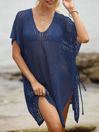 Openwork V-neck slit cover-up by Trendsi, lightweight and breezy with intricate openwork design, perfect for beachwear or poolside.