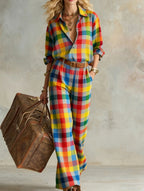 Women's vertical stripe collared casual shirt and wide-leg pants set by Plush Fashion Hub, featuring loose long-sleeve top and matching pants.