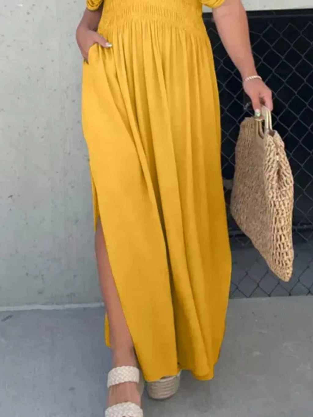 Plus size maxi dress with slit V-neck and smocked waist by Trendsi, featuring flowy fabric and elegant design.