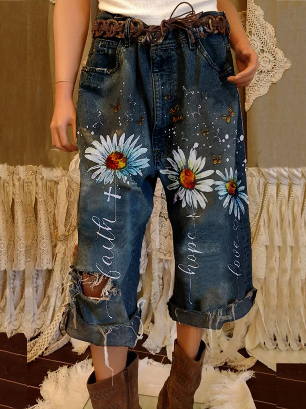 Plus size floral distressed cropped jeans by Trendsi, showcasing the full-length denim with floral embroidery and trendy distressed details.