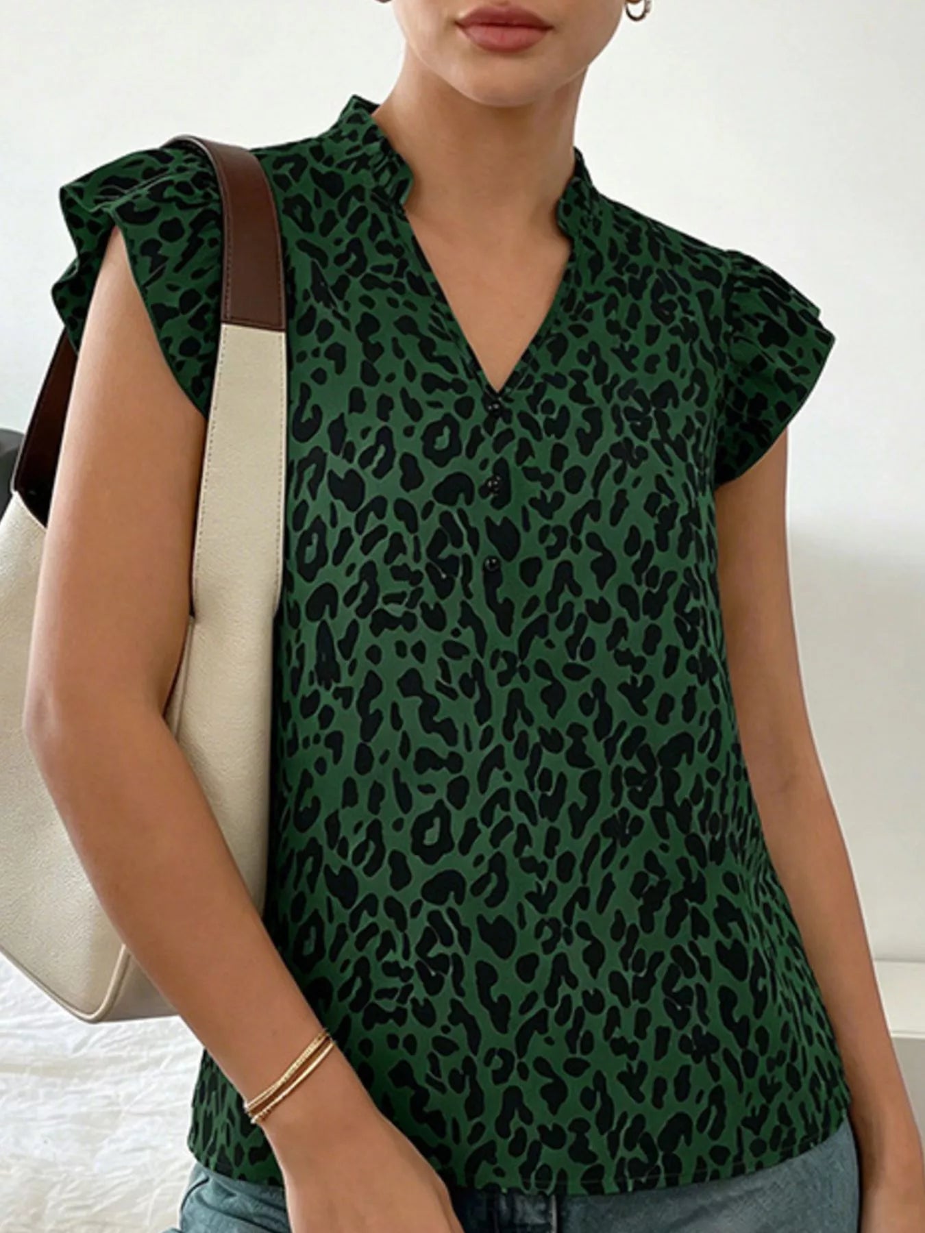 Leopard print ruffle sleeve blouse from Plush Fashion Hub, featuring a stylish design with ruffled sleeves and animal print fabric.