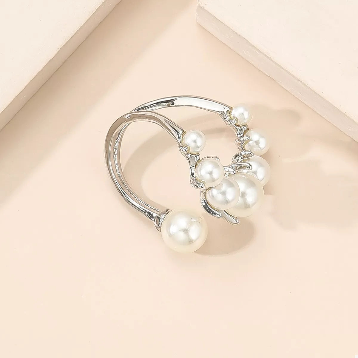 Plush Fashion Hub alloy pearl open ring featuring a sleek band with a central pearl accent, stylish and elegant jewelry piece.