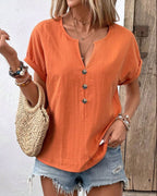 Women's buttoned V-neck short-sleeve T-shirt top from Plush Fashion Hub, shown in a casual fit with a front button detail.