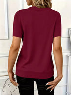 Women's ribbed short sleeve casual top by Trendsi featuring a half-zip front and soft stretch fabric.