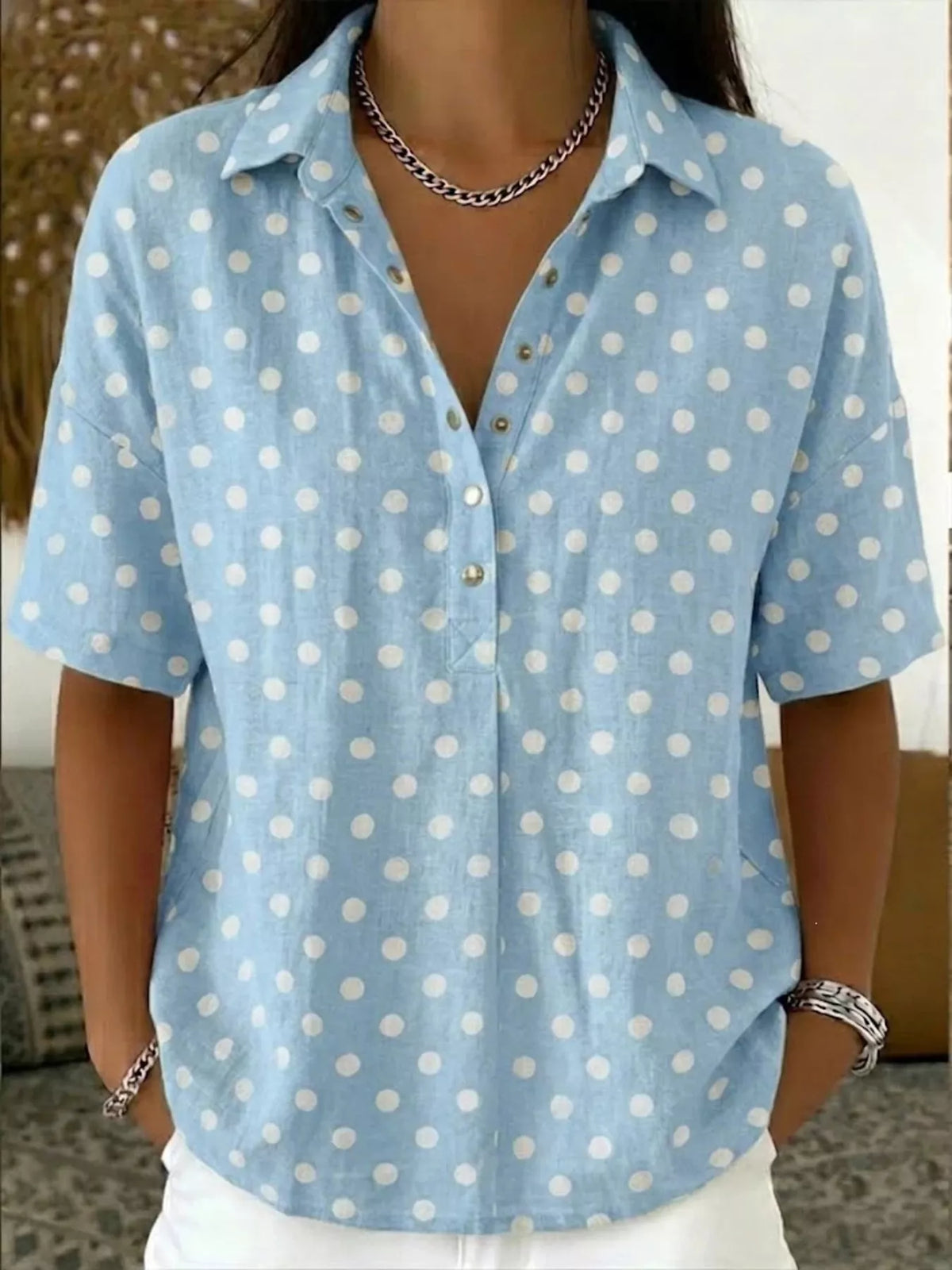 Plus size polka dot short sleeve shirt from Trendsi, stylish full-size top with a classic polka dot pattern and comfortable fit.