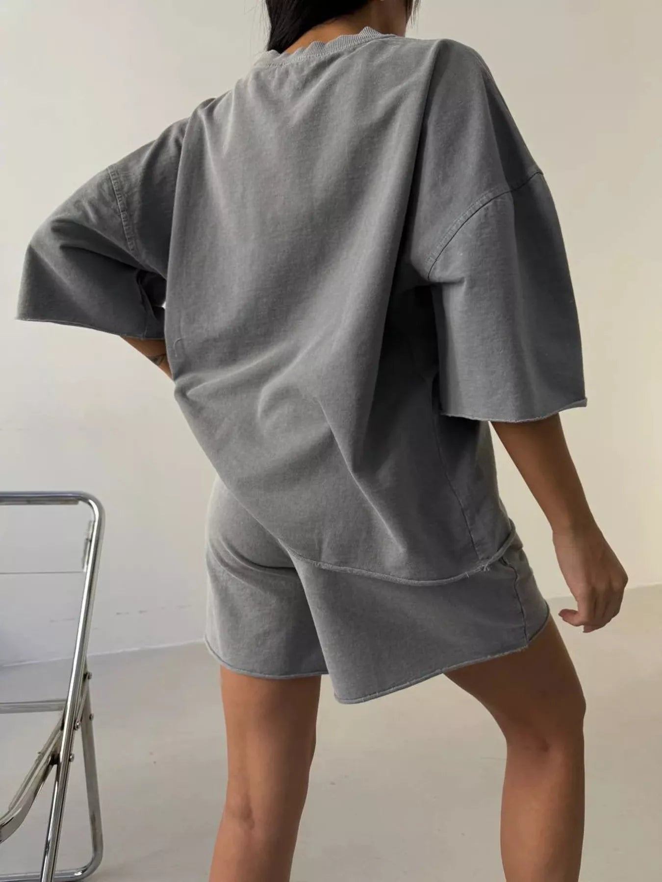 Lounge set featuring a vintage wash oversized tee and matching shorts by Trendsi, casual and comfortable for relaxed wear.