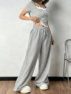 Shopimist tie front short sleeve top and pants set featuring a stylish, coordinated look with a tie-front blouse and matching pants.
