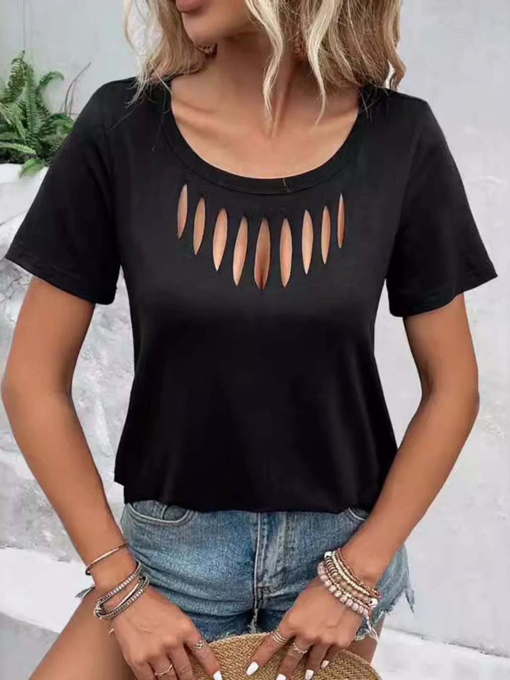 Black short sleeve T-shirt with hollow out neckline from Trendsi, featuring a stylish cutout design for a trendy look