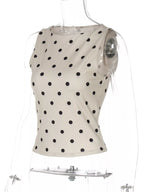 Polka dot tank top by Shopimist featuring a sleeveless design with black and white polka dots, casual summer style.