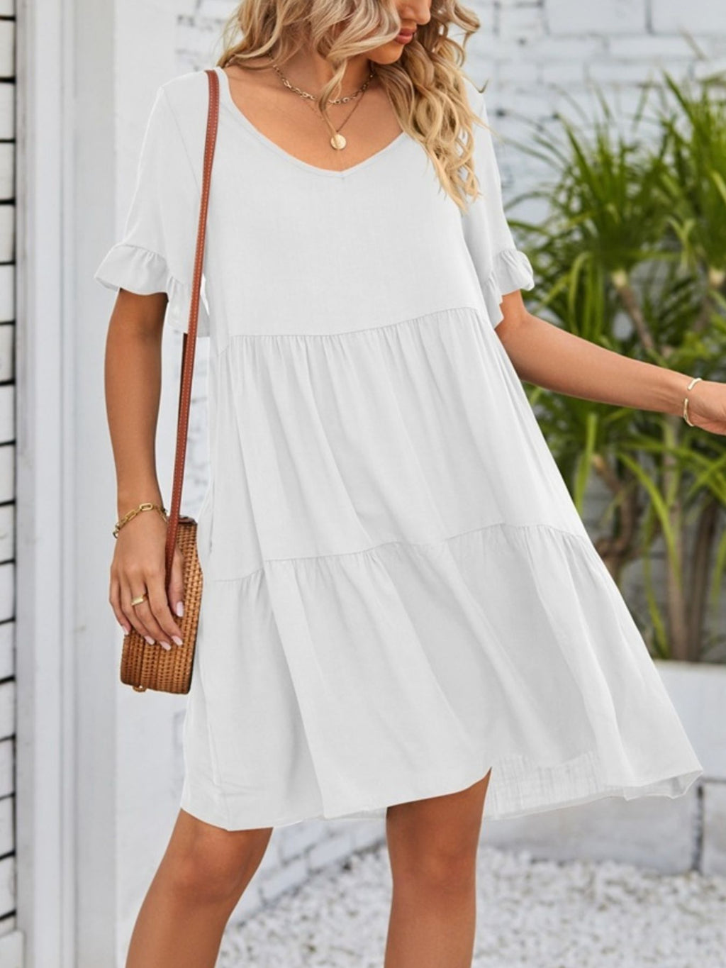 Lightweight rayon ruffled sleeve tiered mini dress with pockets, stylish and feminine, by Trendsi.