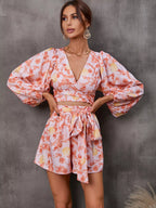 Shopimist cutout front printed long sleeve romper featuring a stylish jumpsuit design with bold graphic print and fitted silhouette.