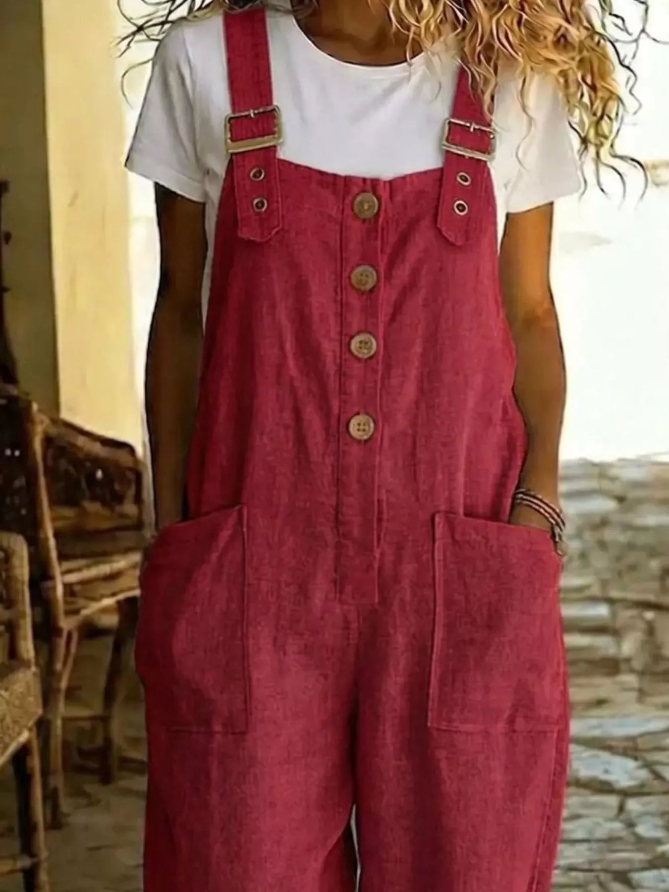 Casual button-front wide-leg overalls by Plush Fashion Hub, featuring adjustable straps and relaxed fit, shown on a model.
