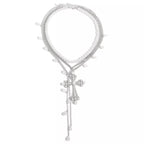 Three-piece set of pearl cross pendant necklaces featuring elegant silver chains, perfect for layered jewelry styles.