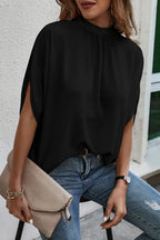 Plush Fashion Hub elegant tie-back half-sleeve blouse with side slit, showcasing soft fabric and stylish design.