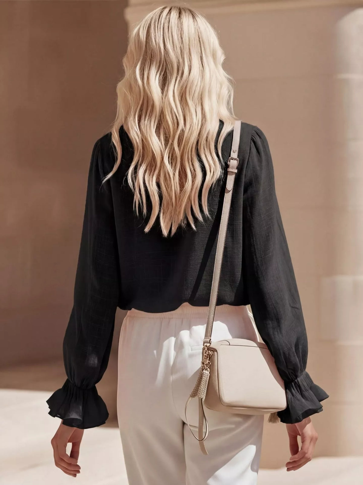 Pink ruffled V-neck long sleeve blouse by Plush Fashion Hub, featuring feminine ruffle details and a stylish V-neck design.