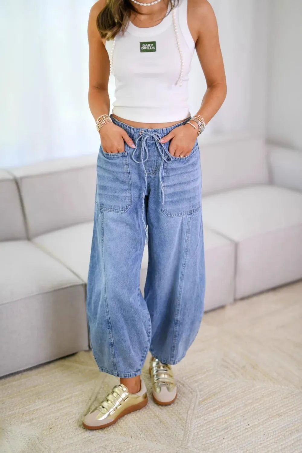 Plush Fashion Shop denim drawstring jeans with front and back pockets, casual style, made from durable denim fabric.