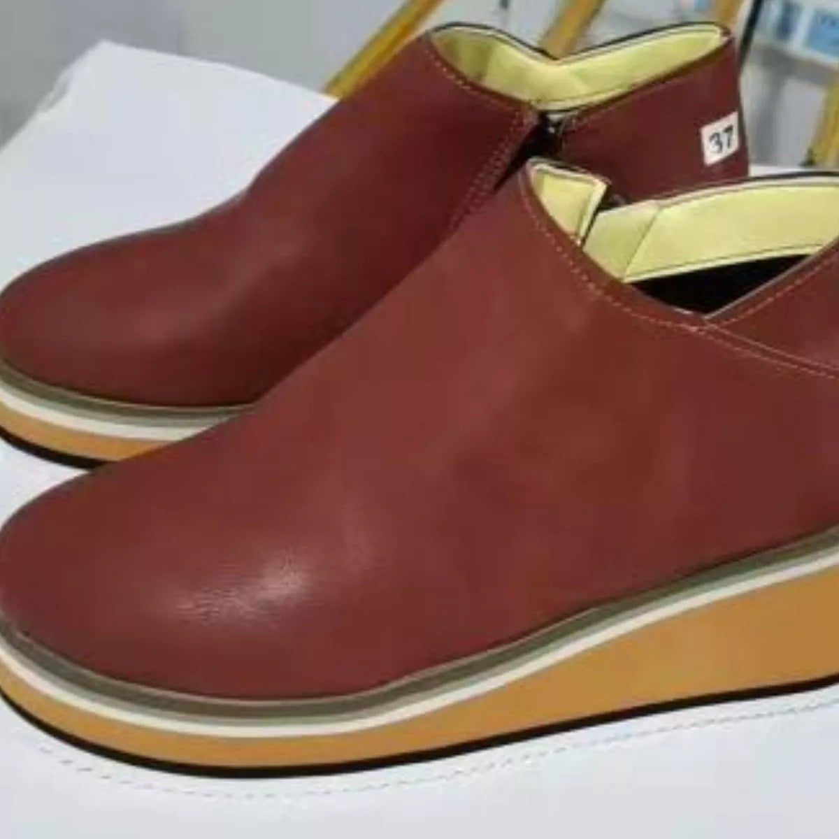 Women's ankle wedge boots with zipper from Trendsi, featuring a stylish design and comfortable heel for everyday wear.
