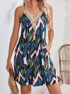 Tropical leaf print V-neck sleeveless dress by Shopimist, featuring vibrant green foliage on lightweight fabric.