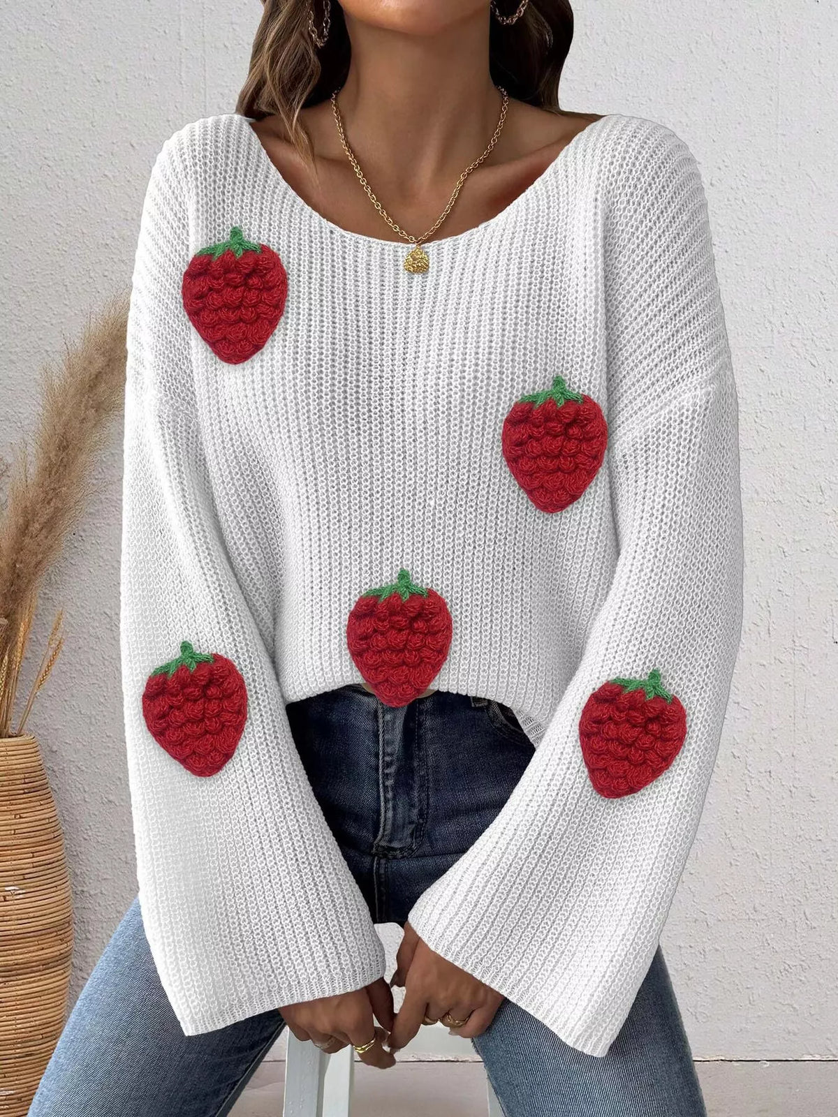 Oversized strawberry applique sweater from Trendsi, with colorful fruit design, cozy knit, and relaxed fit.