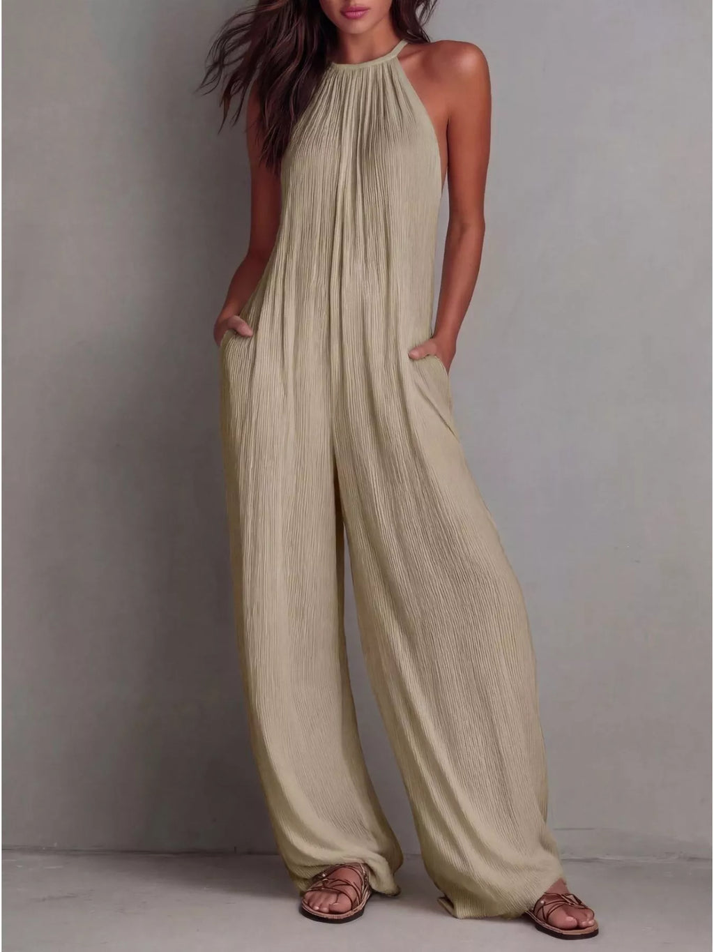 Sleeveless wide-leg jumpsuit by Shopimist featuring a relaxed fit, strapless design, and flowy fabric in a stylish silhouette.