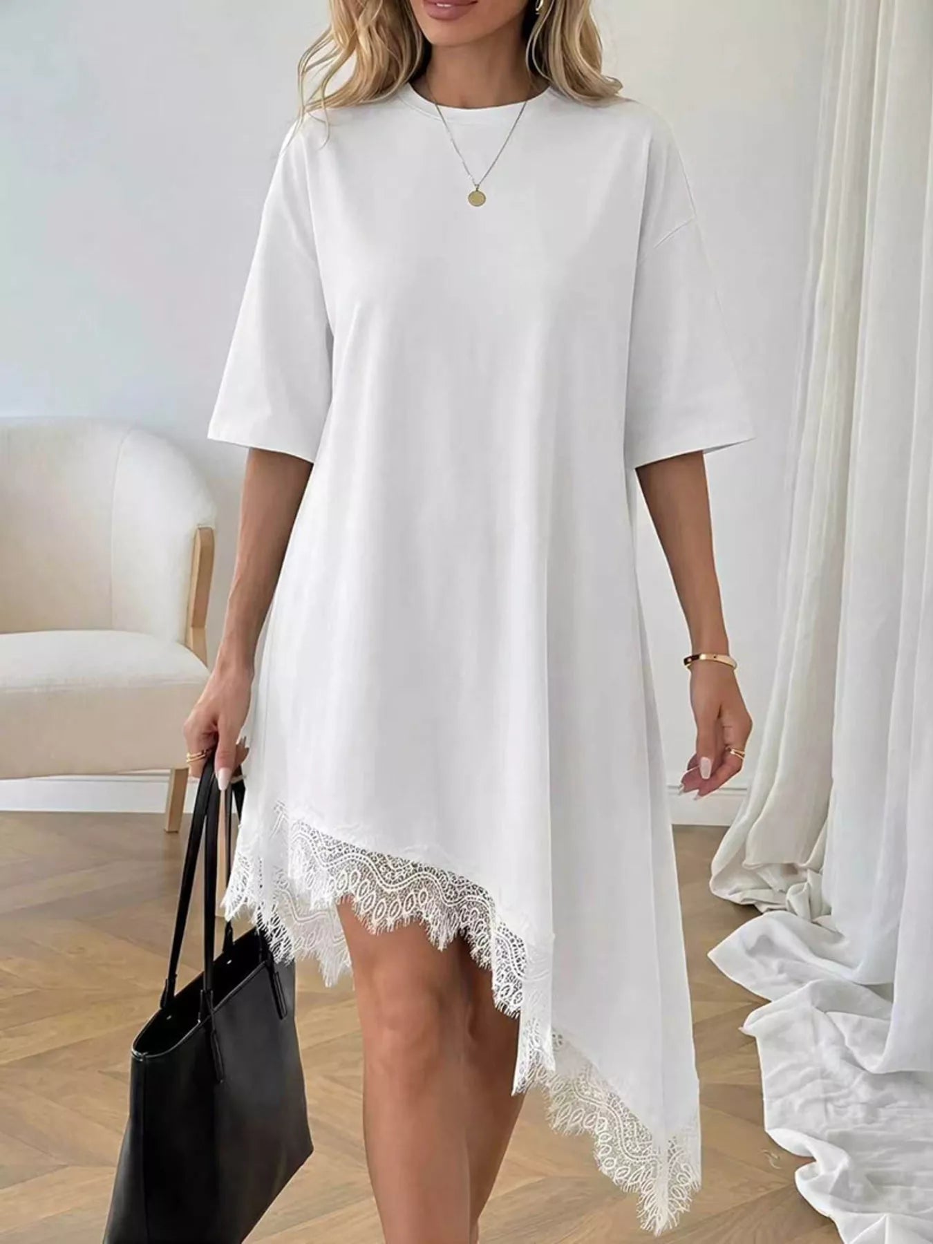Lace trim asymmetrical hem T-shirt dress by Plush Fashion Hub, featuring a relaxed fit with stylish lace accents and casual design.