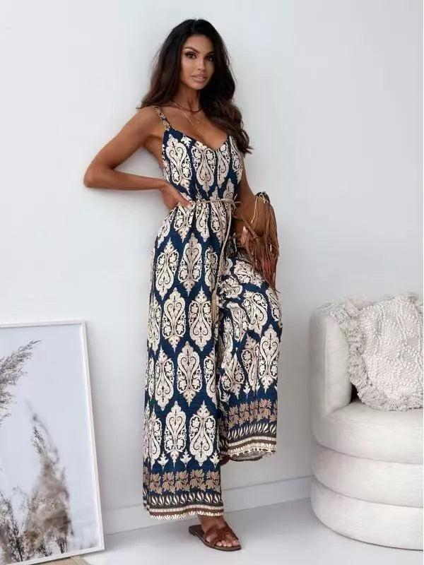 Printed spaghetti strap wide-leg jumpsuit by Shopimist, featuring a stylish design with thin shoulder straps and flowing wide-leg pants.