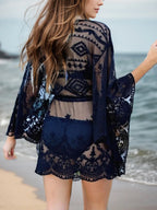 Lace V-neck three-quarter sleeve cover-up dress by Trendsi, featuring delicate lace fabric and a flattering V-neck design.