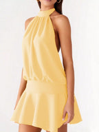 Backless halter neck dress with gathered waist from Plush Fashion Hub, showcasing a stylish and elegant design.