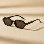 Hexagonal small-frame sunglasses by FitiqueFit with UV protection, featuring sleek unisex eyewear design and polyhedral lens shape.