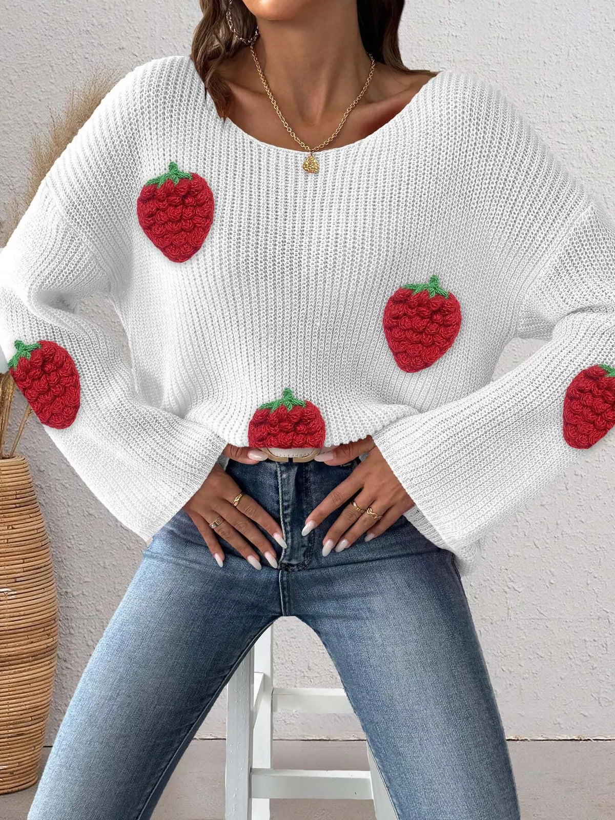 Strawberry applique oversized sweater in cozy knit, featuring colorful strawberry designs, from Trendsi.