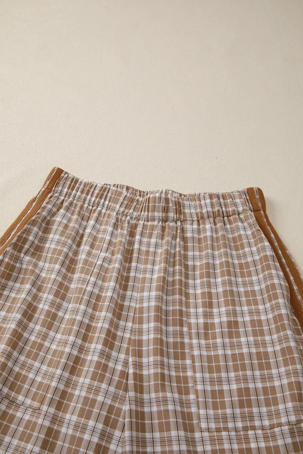 Plaid print casual pants with tie detail from Plush Fashion Hub, featuring a relaxed fit and stylish plaid pattern.