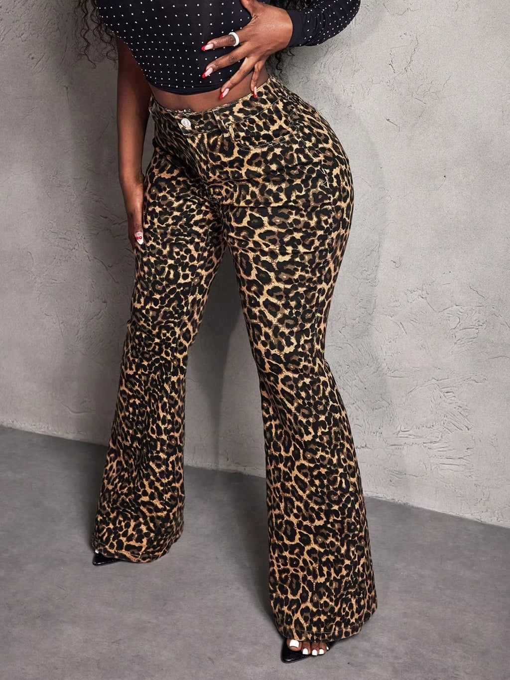 Leopard print wide-leg pants by Shopimist displayed on a model, showing the flowy silhouette and bold animal print fabric.